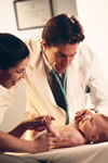 Dr. with mother and baby