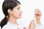 Doctor holding vaccine needle